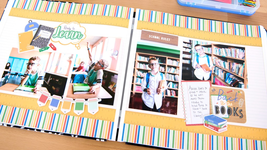 Back To School two page spread with four photos of an elementary school student in school, school themed stickers and embellishments.