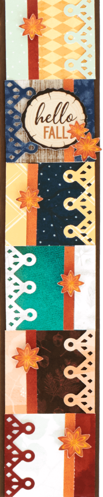 Fall-themed scrapbook border with small flower embellishments.