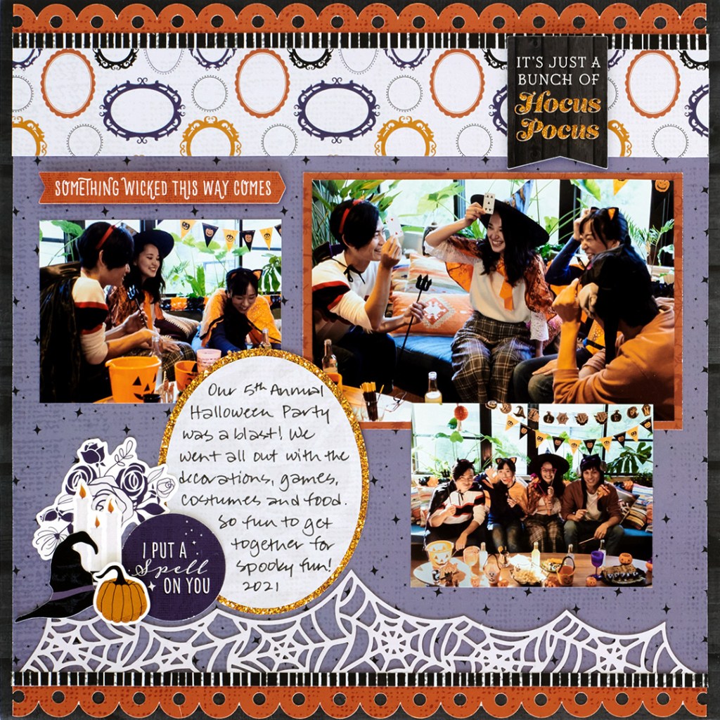 Halloween layout with three photos of people at a Halloween party, witch-themed stickers and a spiderweb bottom border.