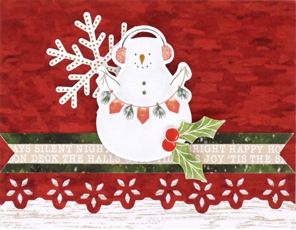 Horizontal snowman holiday card with a red background and snowman embellishment.