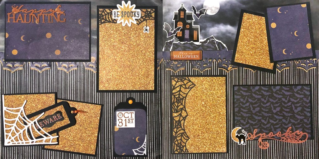 Halloween-themed two page spread with photo mats, spiderweb borders and a haunted house embellishment.