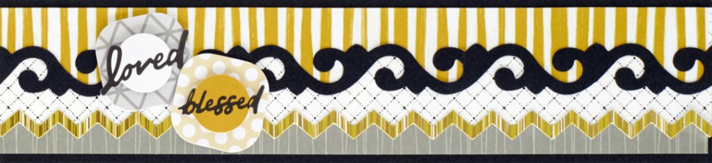 Silver and gold scrapbooking border with stickers that say "loved" and "blessed".
