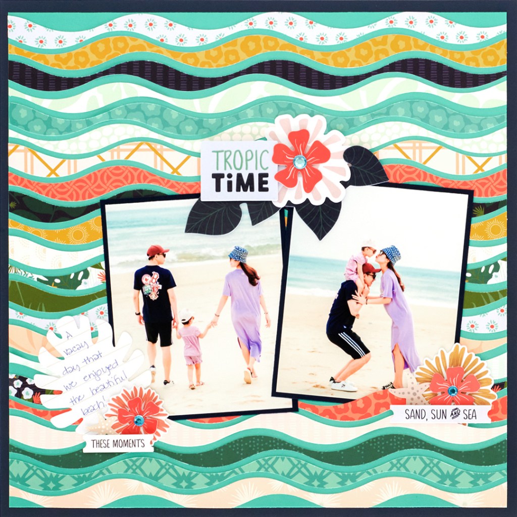 Tropical scrapbook layout with photos of a family on a beach, floral embellishments and journaling.