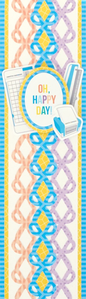 Scrapbooking themed vertical scrapbook border with three layered scissor border punches and layered stickers.