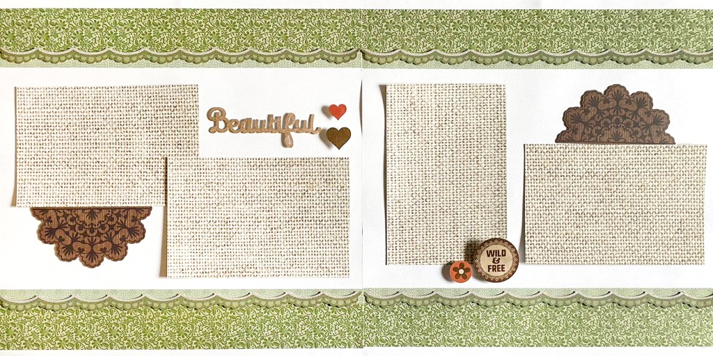 Two-page scrapbook spread with four photo placeholders, decorative borders along the top and bottom and embellishments.