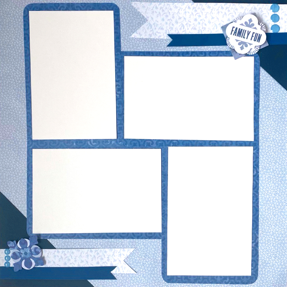 Blue scrapbooking layout with four photo placeholders and embellishments.