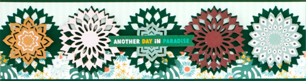 Boho-themed scrapbook border with mandala punch cutouts and layered embellishments.