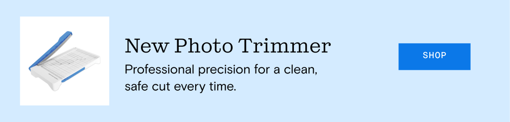 Image of a photo trimmer with a blue handle on a light blue background, promoting professional precision for clean cuts.