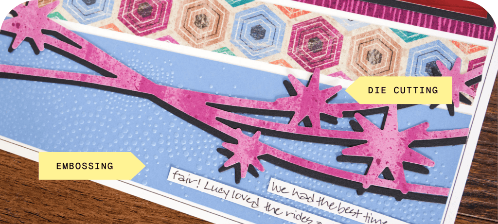A crafting project featuring a layered card design with embossed blue paper, die-cut pink branches, and a patterned top layer. Labels indicate 'Embossing' and 'Die Cutting' techniques.