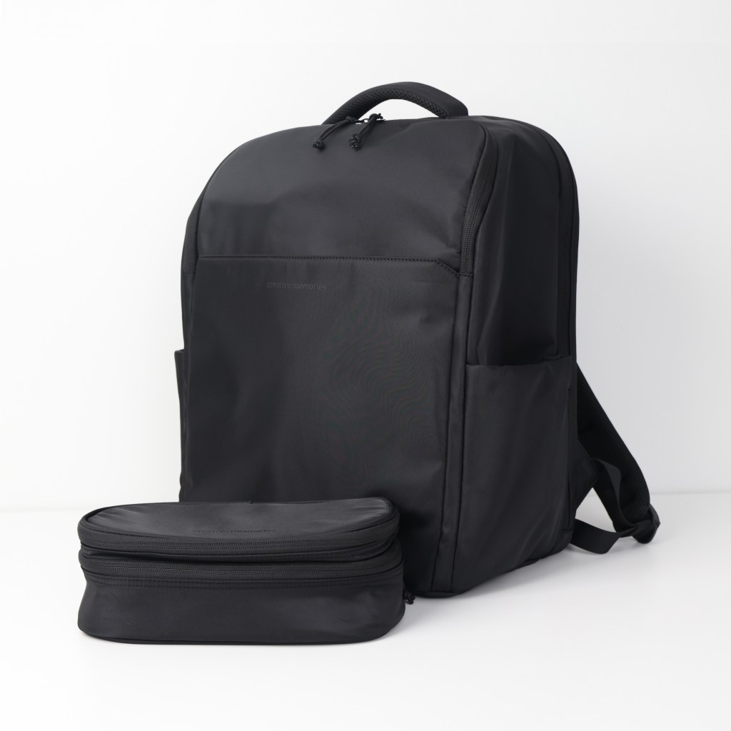 A sleek black backpack with a minimalist design, accompanied by a detachable black zippered pouch.