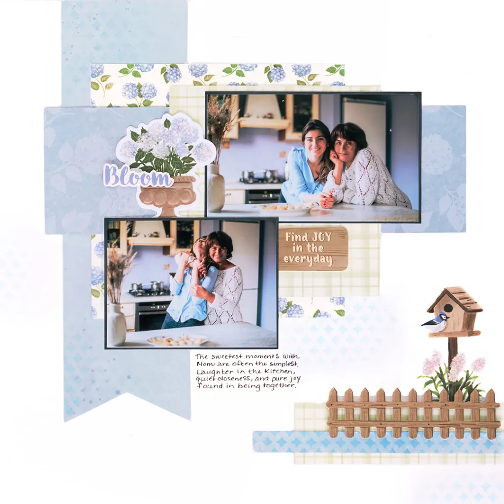 A scrapbook page featuring two photos of a woman and her mother sharing joyful moments in a kitchen setting, along with decorative elements like flowers and a birdhouse.